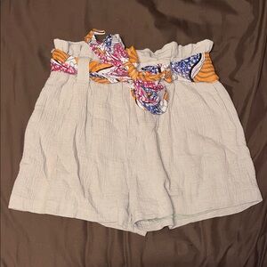 Elegant High Waist Cream Shorts with Vibrant Belt